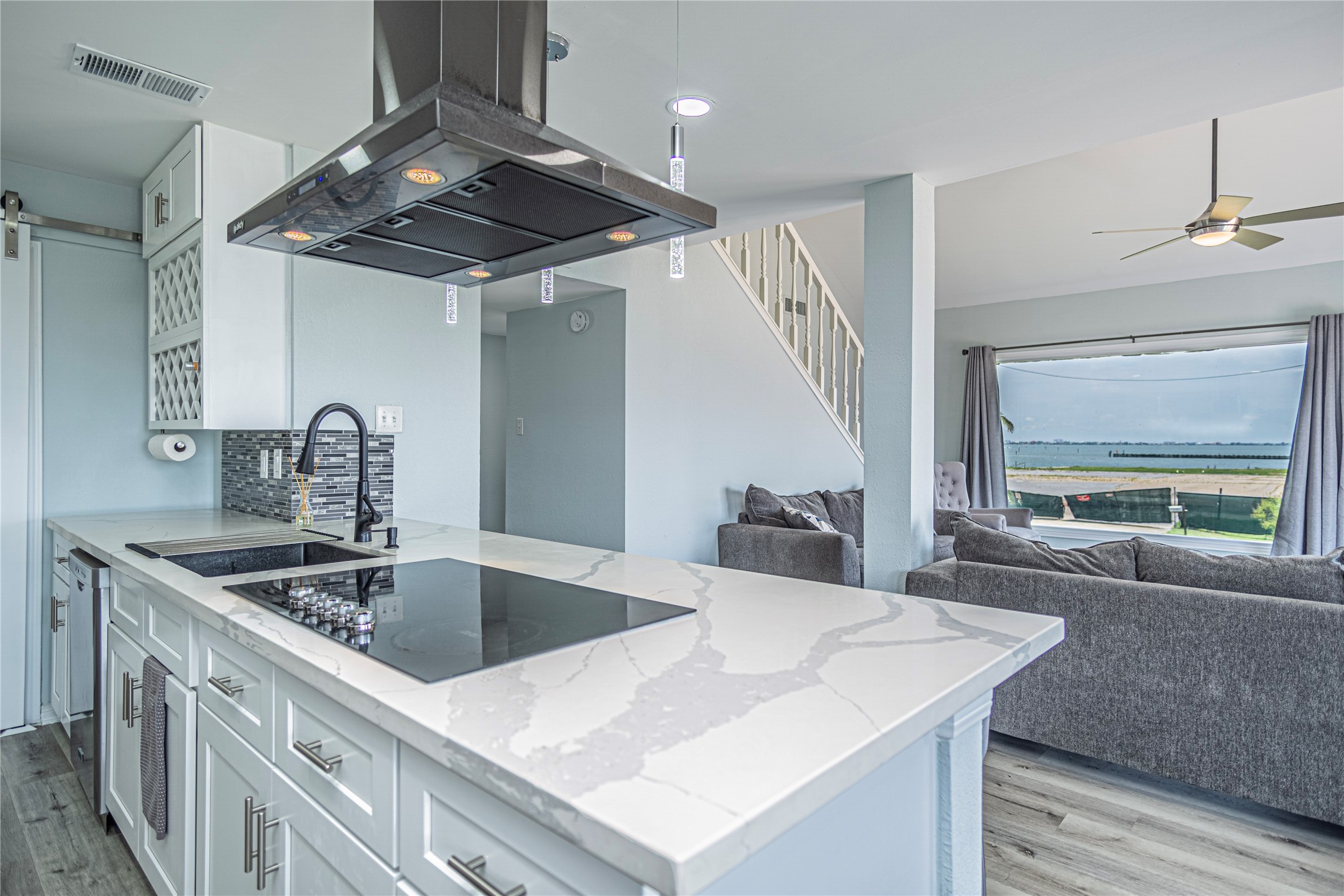 301 Commander Drive Tiki Island, TX 77554 - Photo 14 of 35 a kitchen with stainless steel appliances granite countertop a sink and a refrigerator