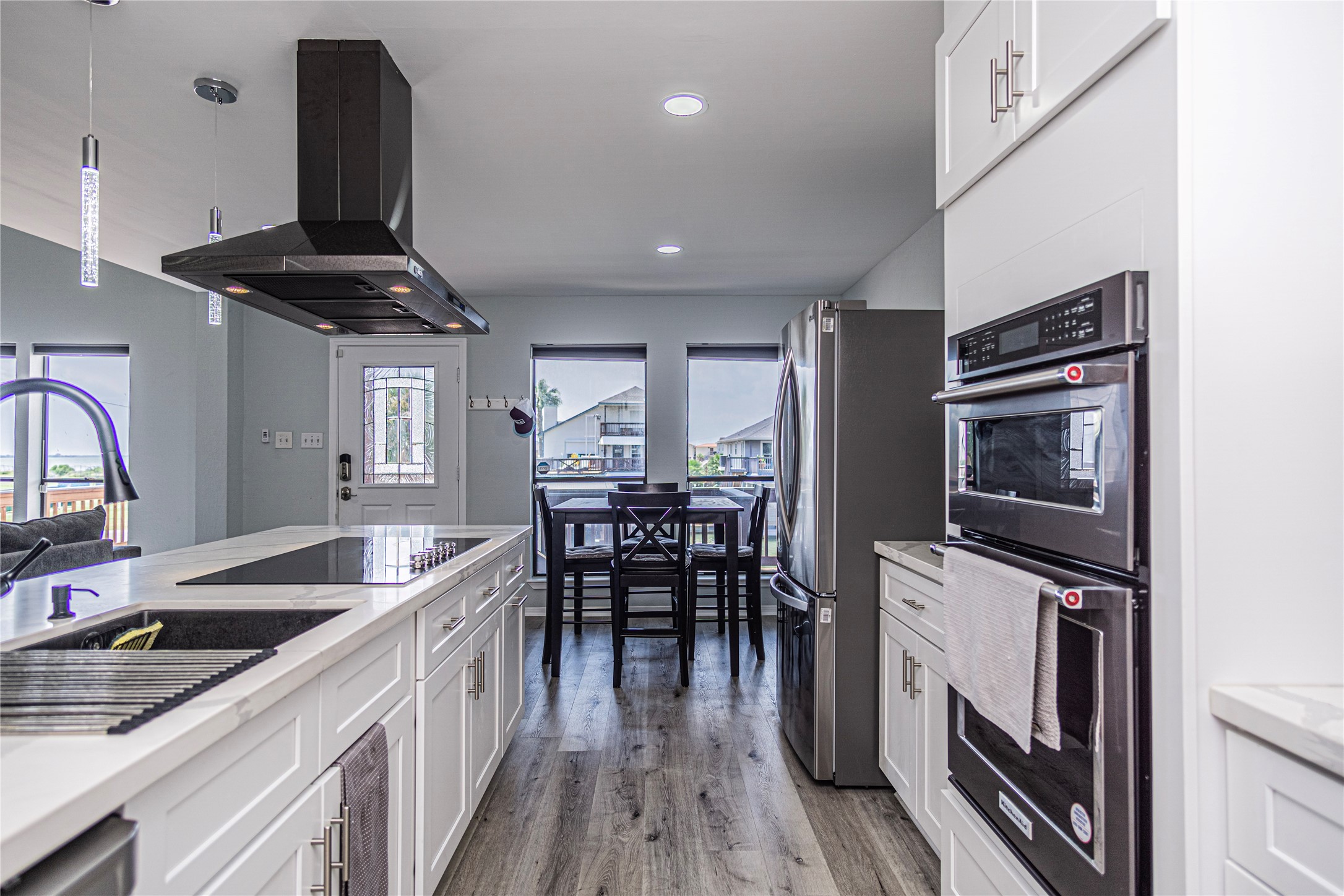 301 Commander Drive Tiki Island, TX 77554 - Photo 16 of 35 a kitchen with granite countertop a stove and a sink