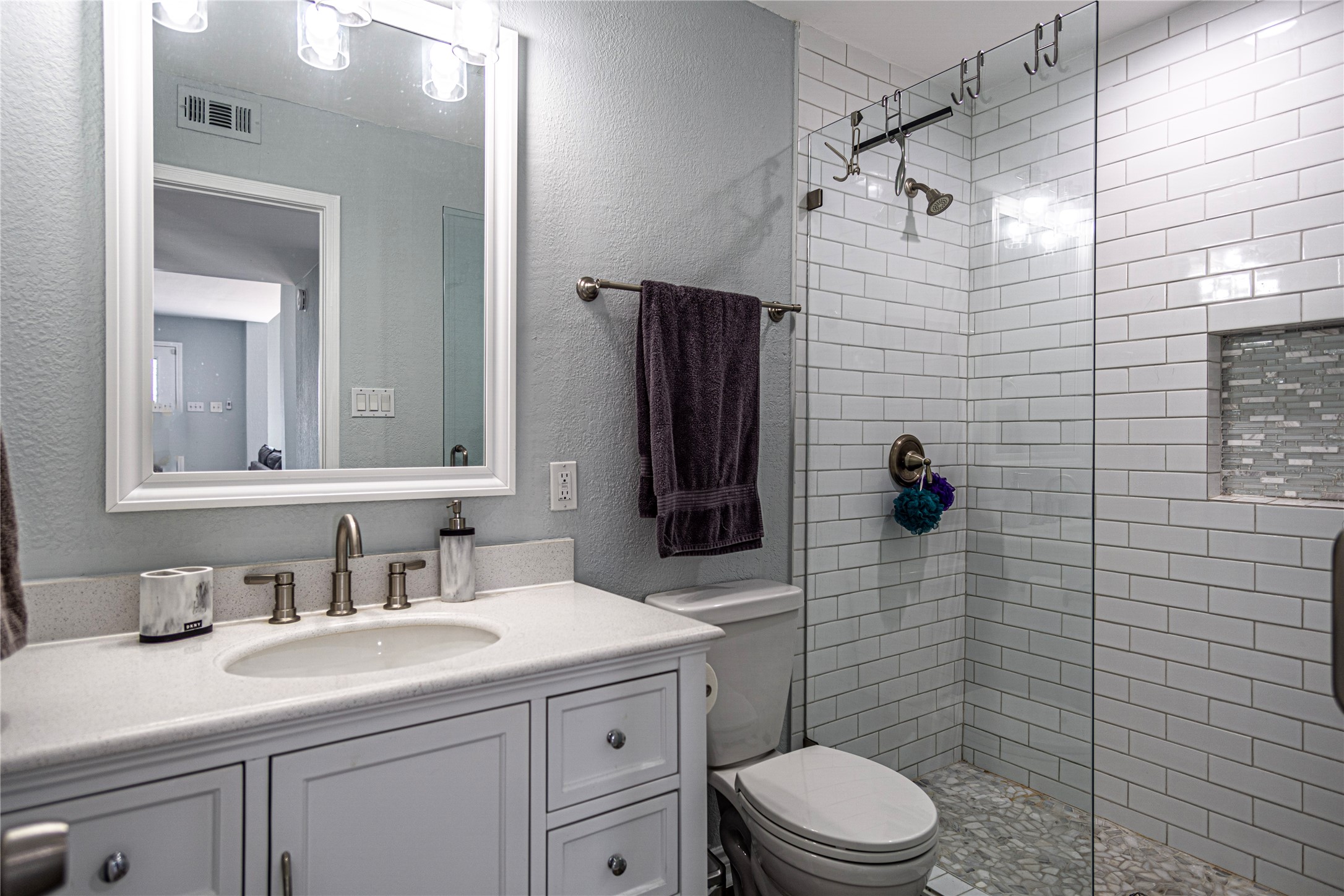 301 Commander Drive Tiki Island, TX 77554 - Photo 19 of 35 a bathroom with a sink a toilet and shower