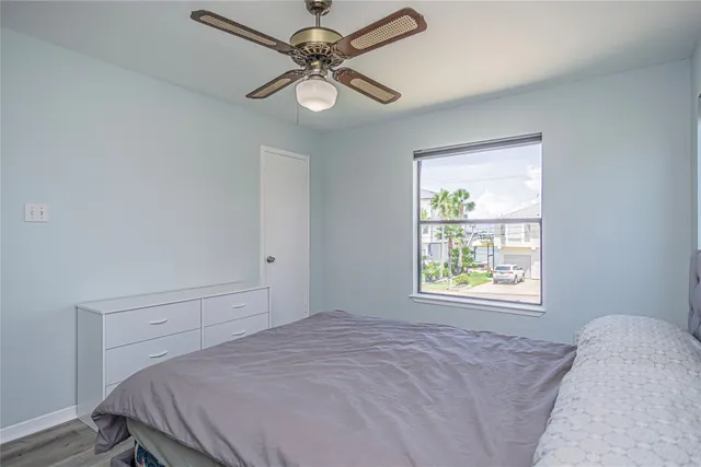 a bedroom with a bed window and a window