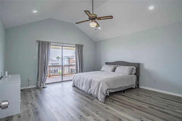 a spacious bedroom with a bed and a window