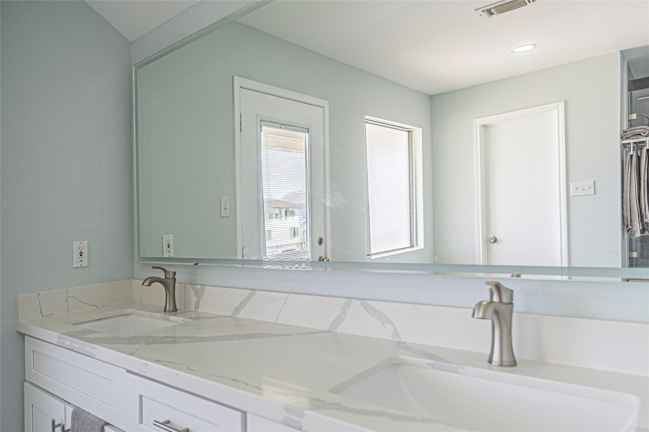 301 Commander Drive Tiki Island, TX 77554 - Photo 27 of 35 a bathroom with a sink and a mirror