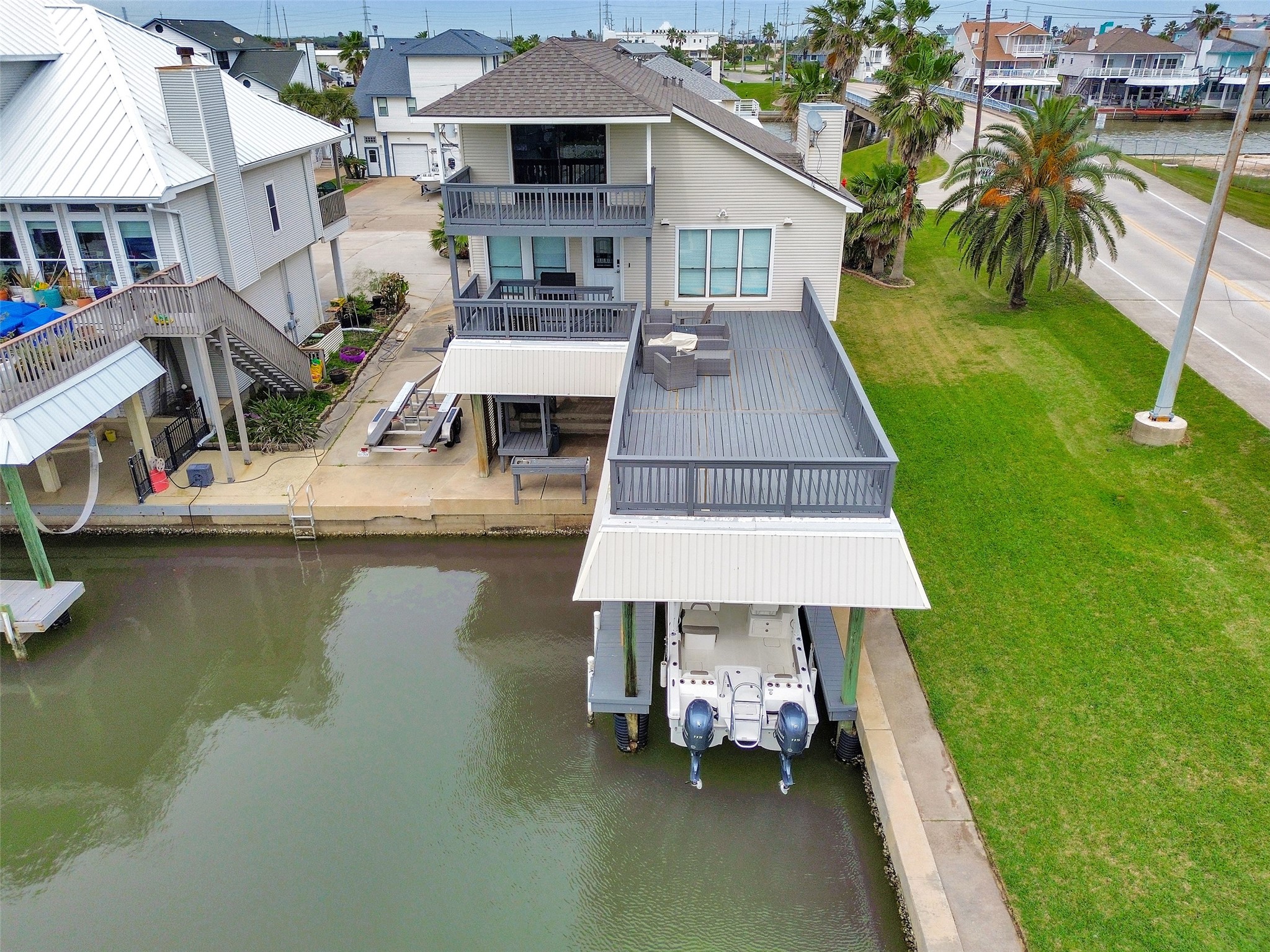 301 Commander Drive Tiki Island, TX 77554 - Photo 29 of 35 an aerial view of a house with swimming pool patio and lake view