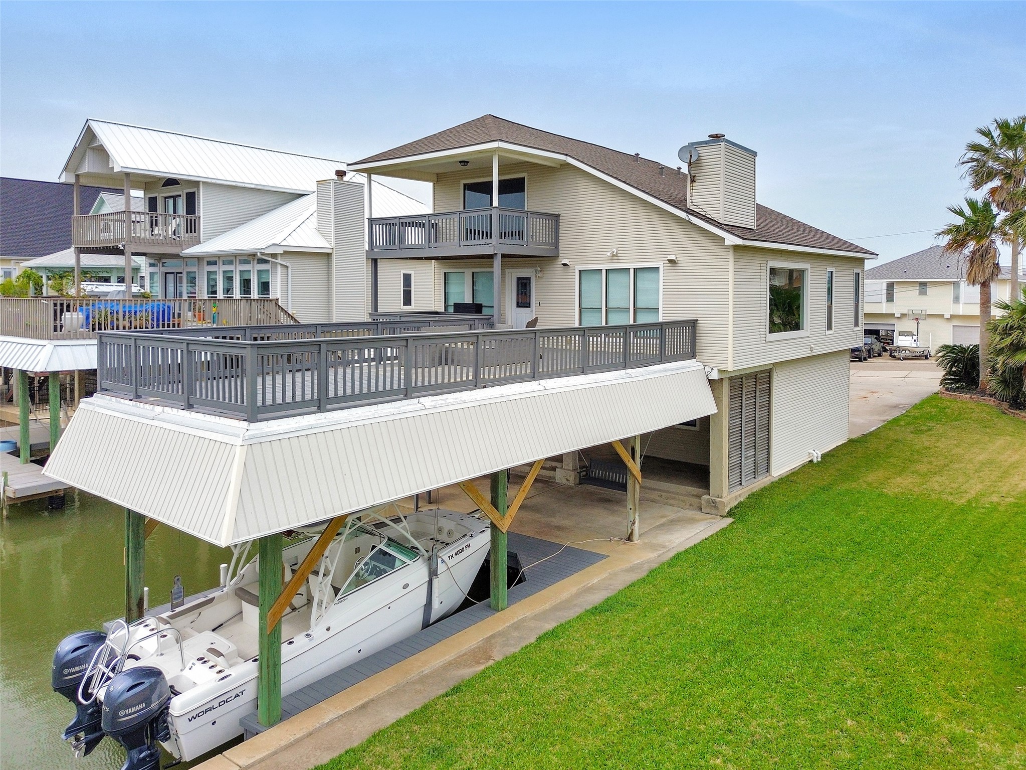 301 Commander Drive Tiki Island, TX 77554 - Photo 30 of 35 a view of a house with roof deck and couches