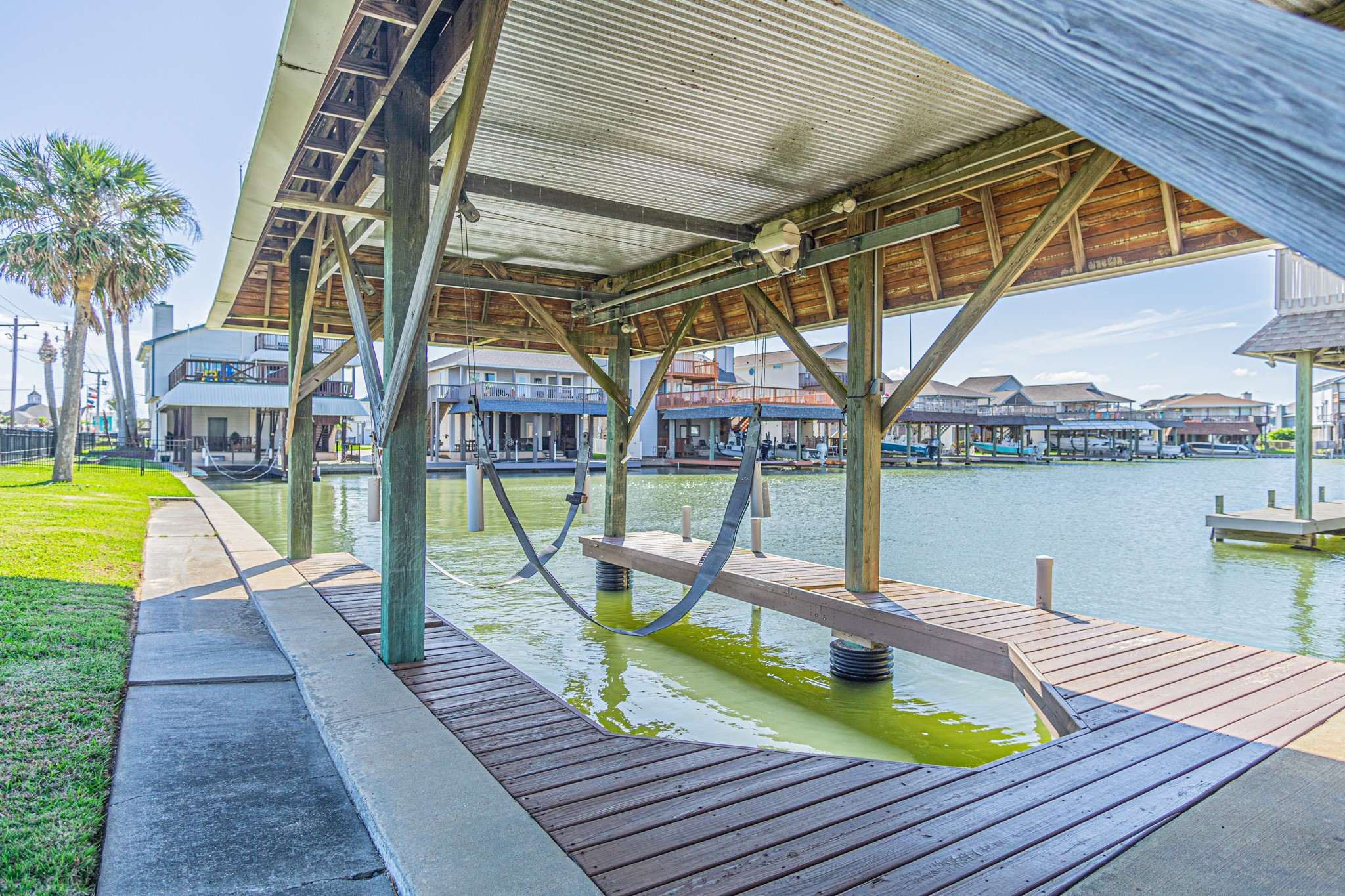 301 Commander Drive Tiki Island, TX 77554 - Photo 4 of 35 a view of a swimming pool with a patio and a lake view