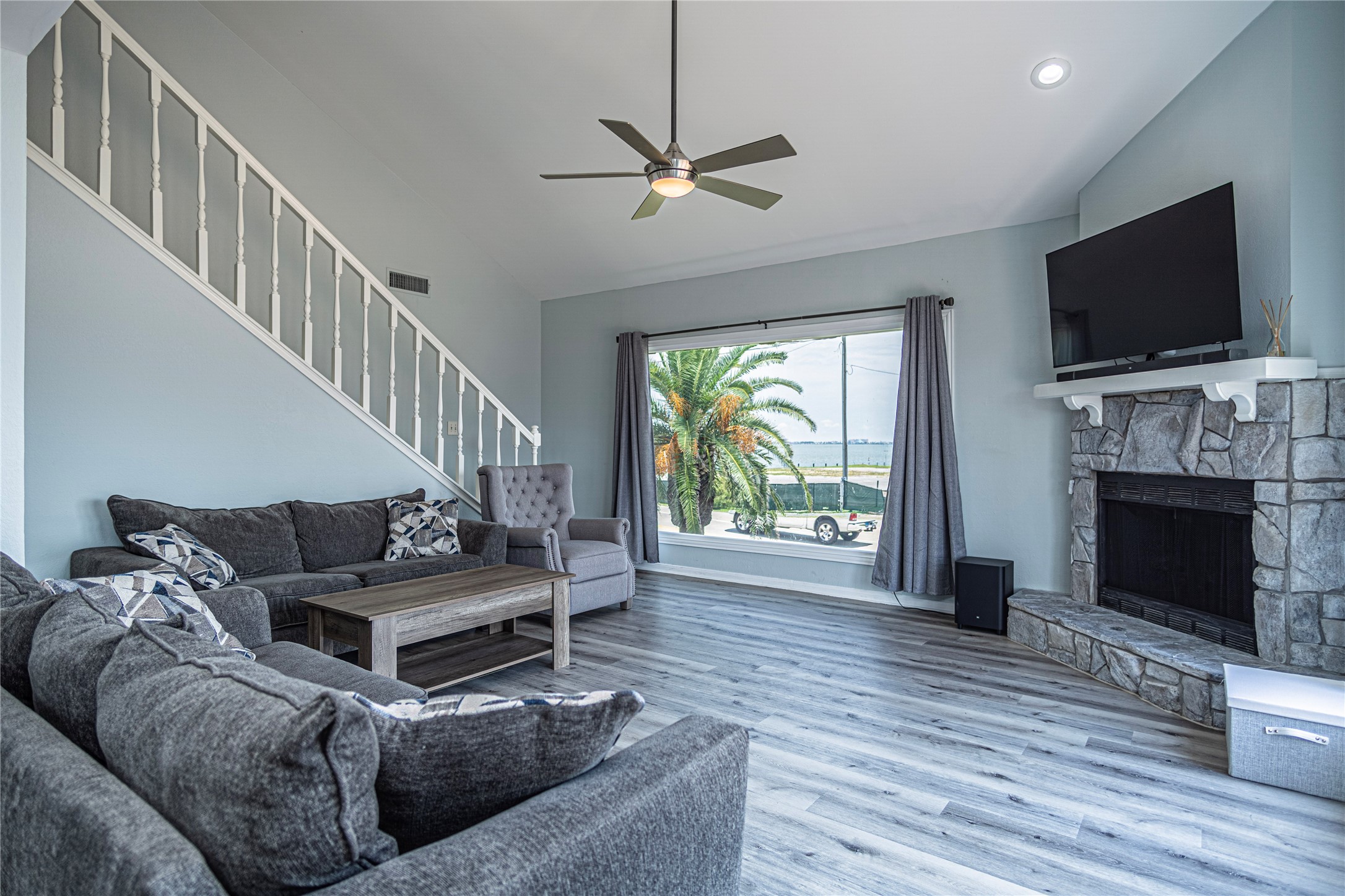 301 Commander Drive Tiki Island, TX 77554 - Photo 5 of 35 a living room with furniture and a flat screen tv