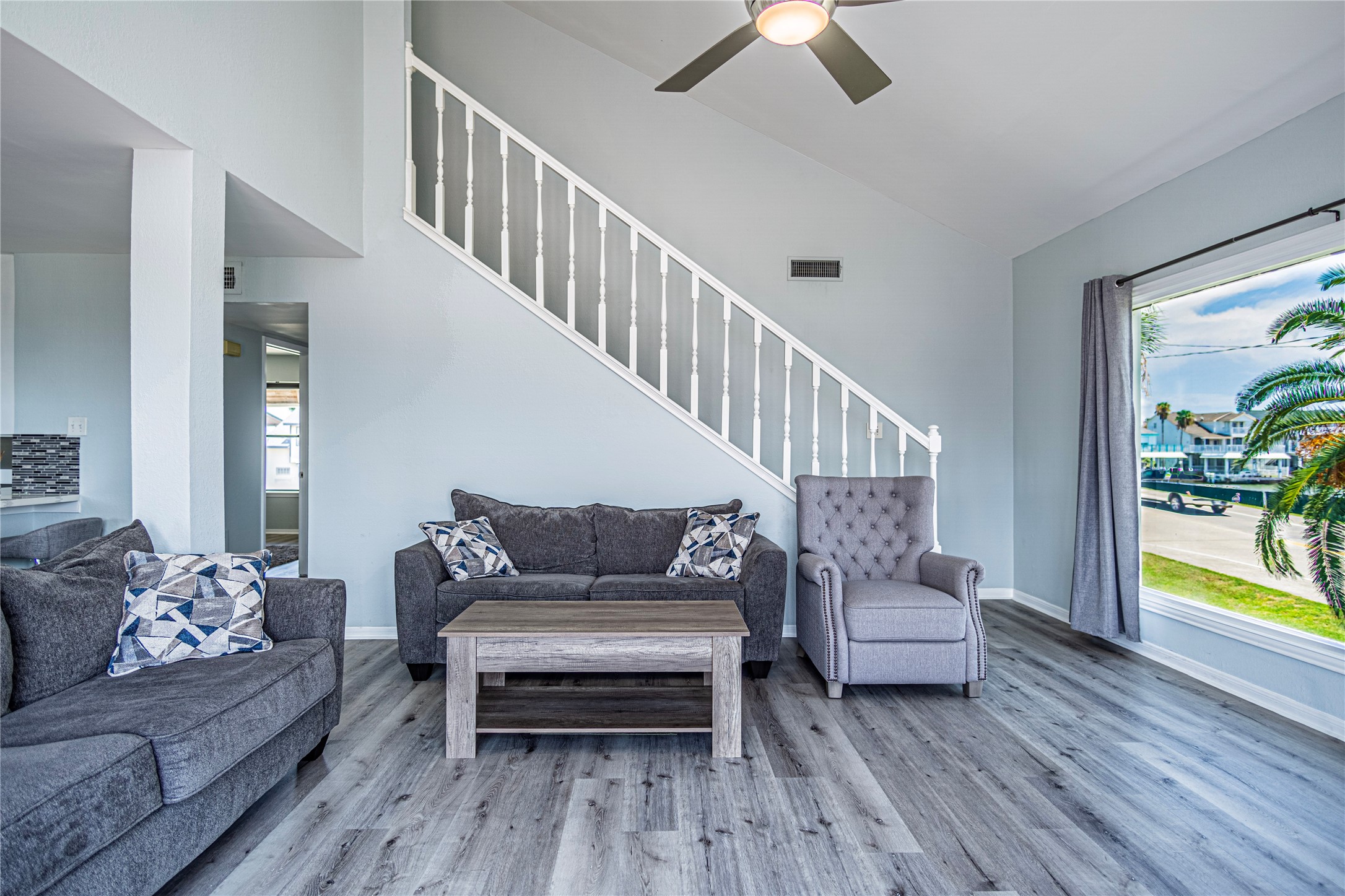 301 Commander Drive Tiki Island, TX 77554 - Photo 6 of 35 a living room with furniture and a wooden floor