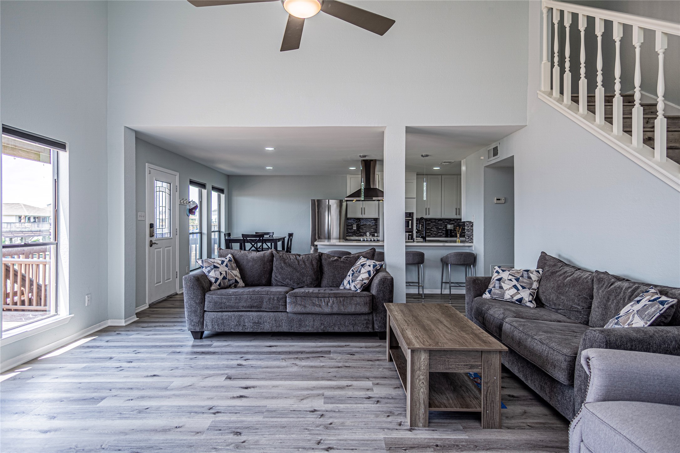 301 Commander Drive Tiki Island, TX 77554 - Photo 7 of 35 a living room with furniture and a wooden floor