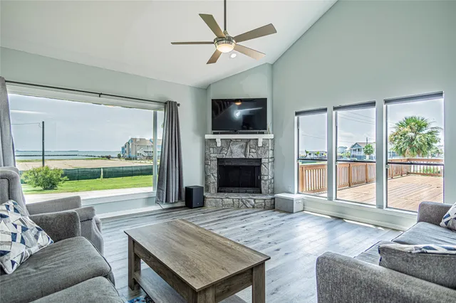 a living room with fireplace furniture and a flat screen tv