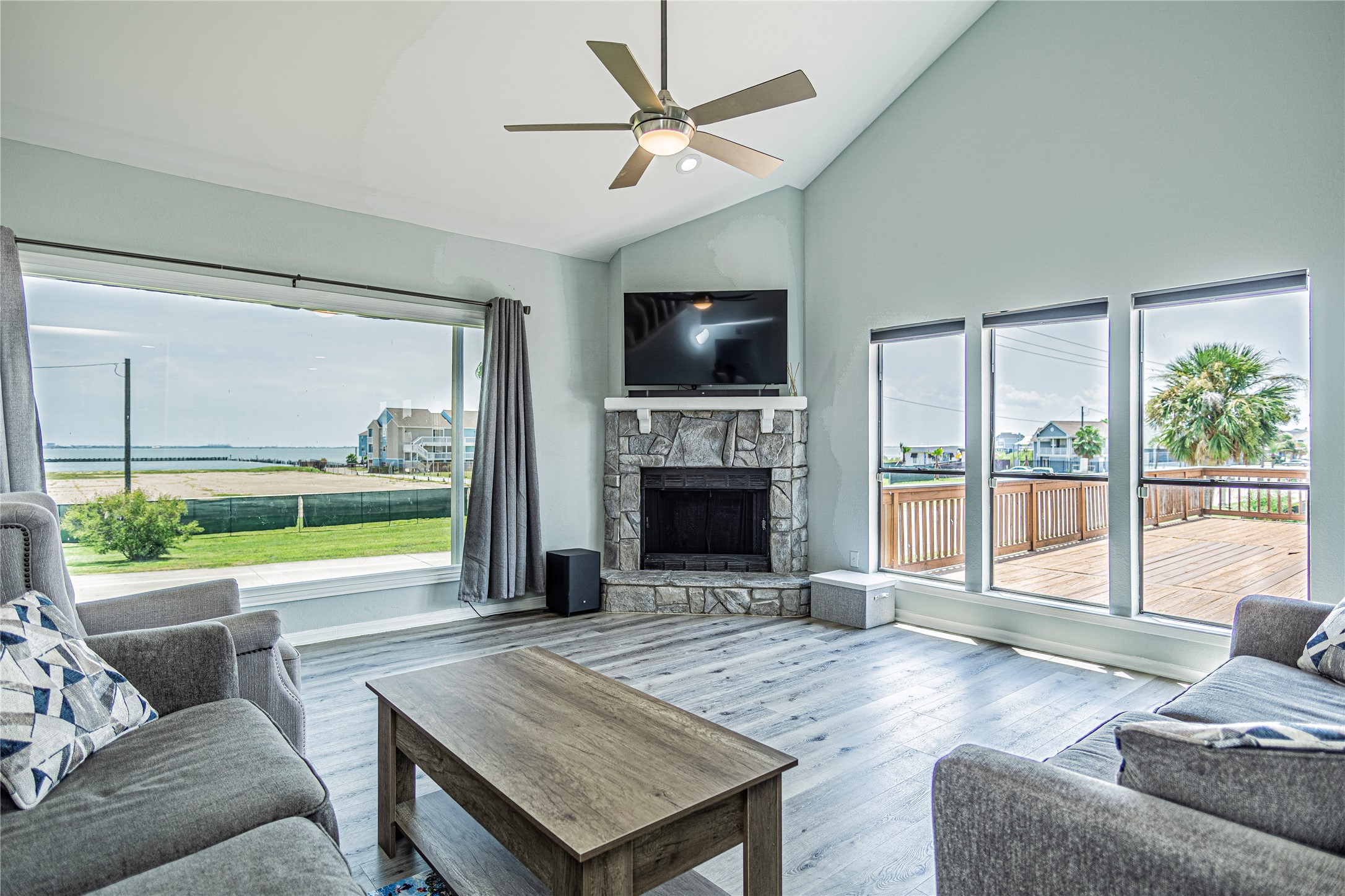 301 Commander Drive Tiki Island, TX 77554 - Photo 10 of 35 a living room with fireplace furniture and a flat screen tv