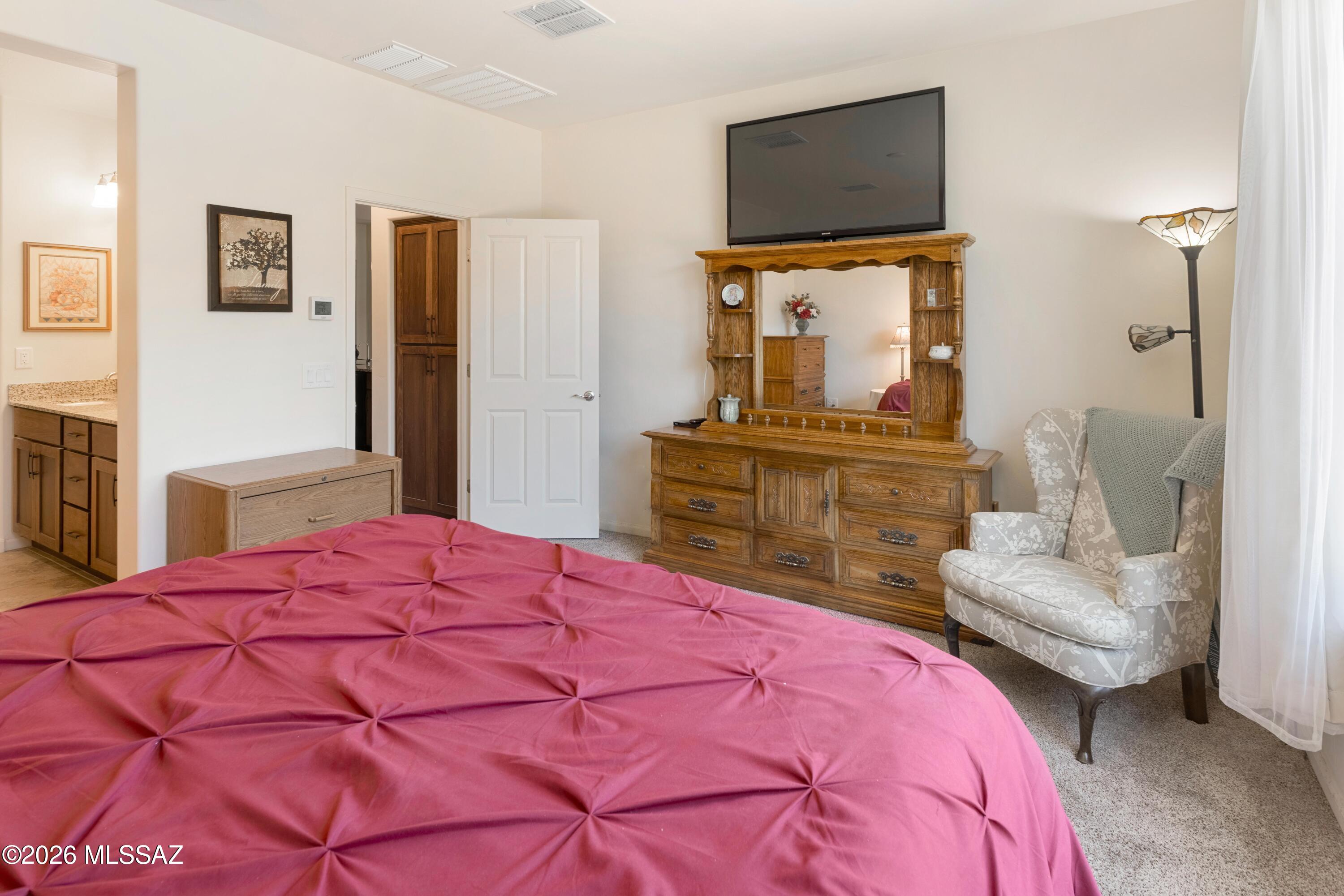 61193 East Shale Road Oracle, AZ 85623 - Photo 16 of 50 a bedroom with a bed and a couch