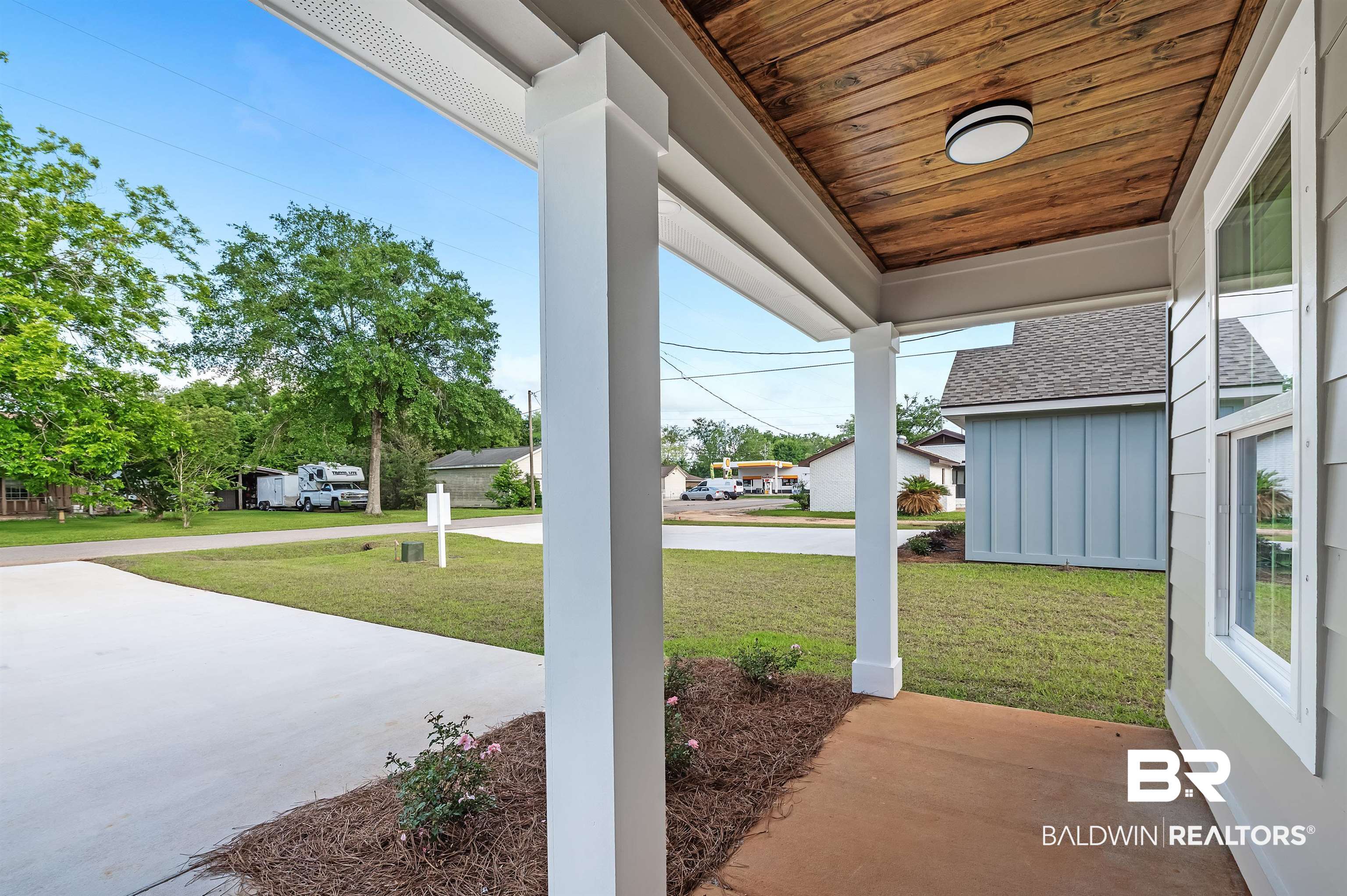22045 8th Street Silverhill, AL 36576 - Photo 4 of 39 Porch with a lawn