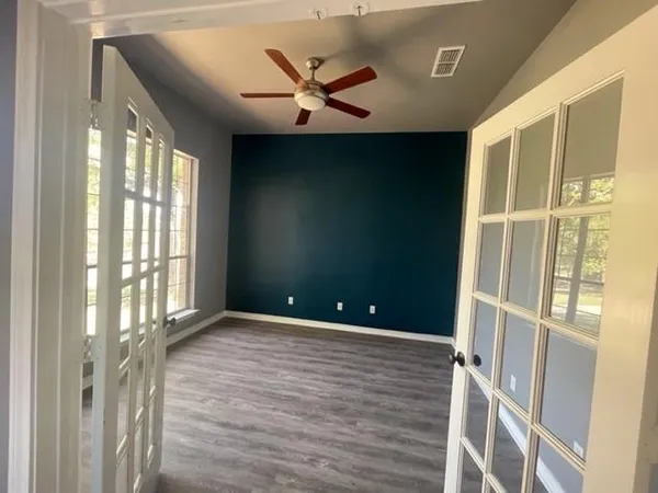 a view of an empty room with a window
