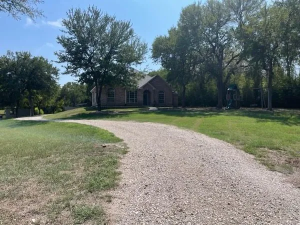 a swimming pool with trees in the background