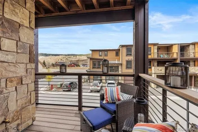 a view of a balcony with chairs