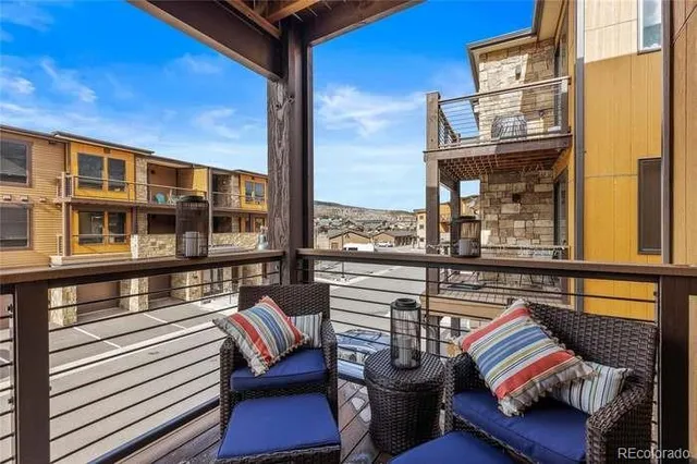 a view of a balcony with furniture