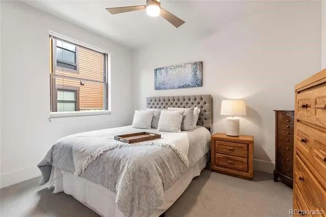 a bedroom with a bed and a television