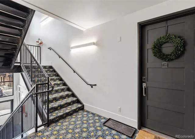 a view of entryway with wooden floor