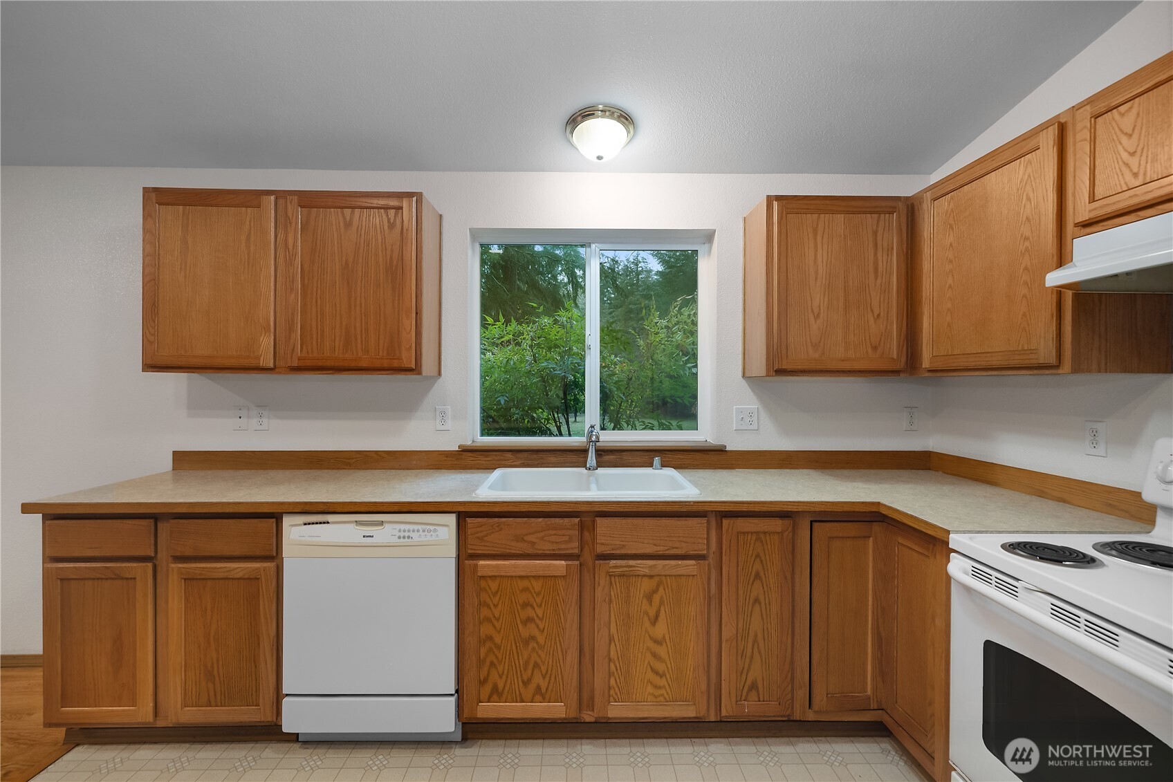2261 East Phillips Lake Loop Road Shelton, WA 98584 - Photo 12 of 37 a kitchen with a sink and a window