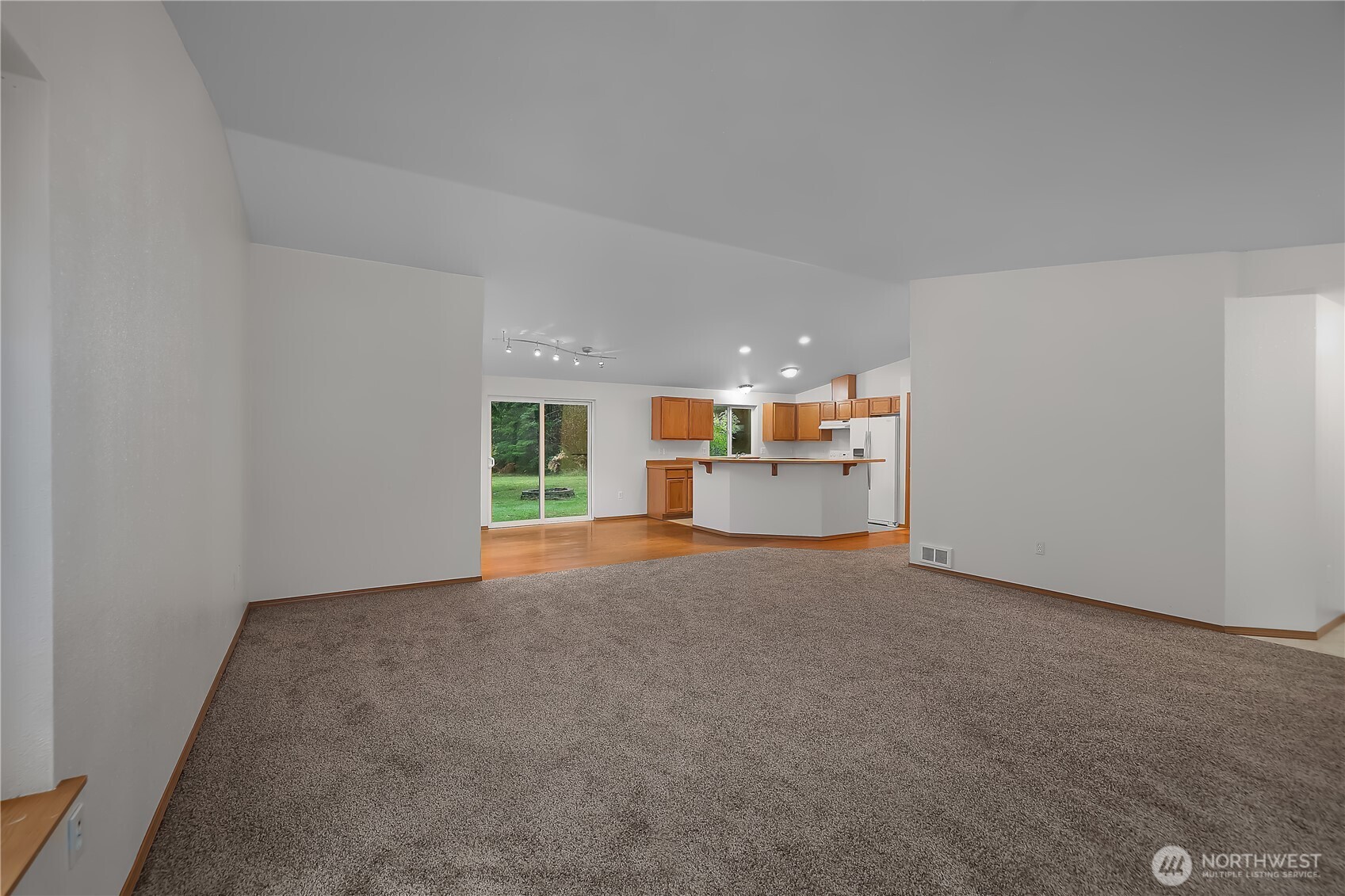 2261 East Phillips Lake Loop Road Shelton, WA 98584 - Photo 17 of 37 a view of a kitchen with a sink and a refrigerator