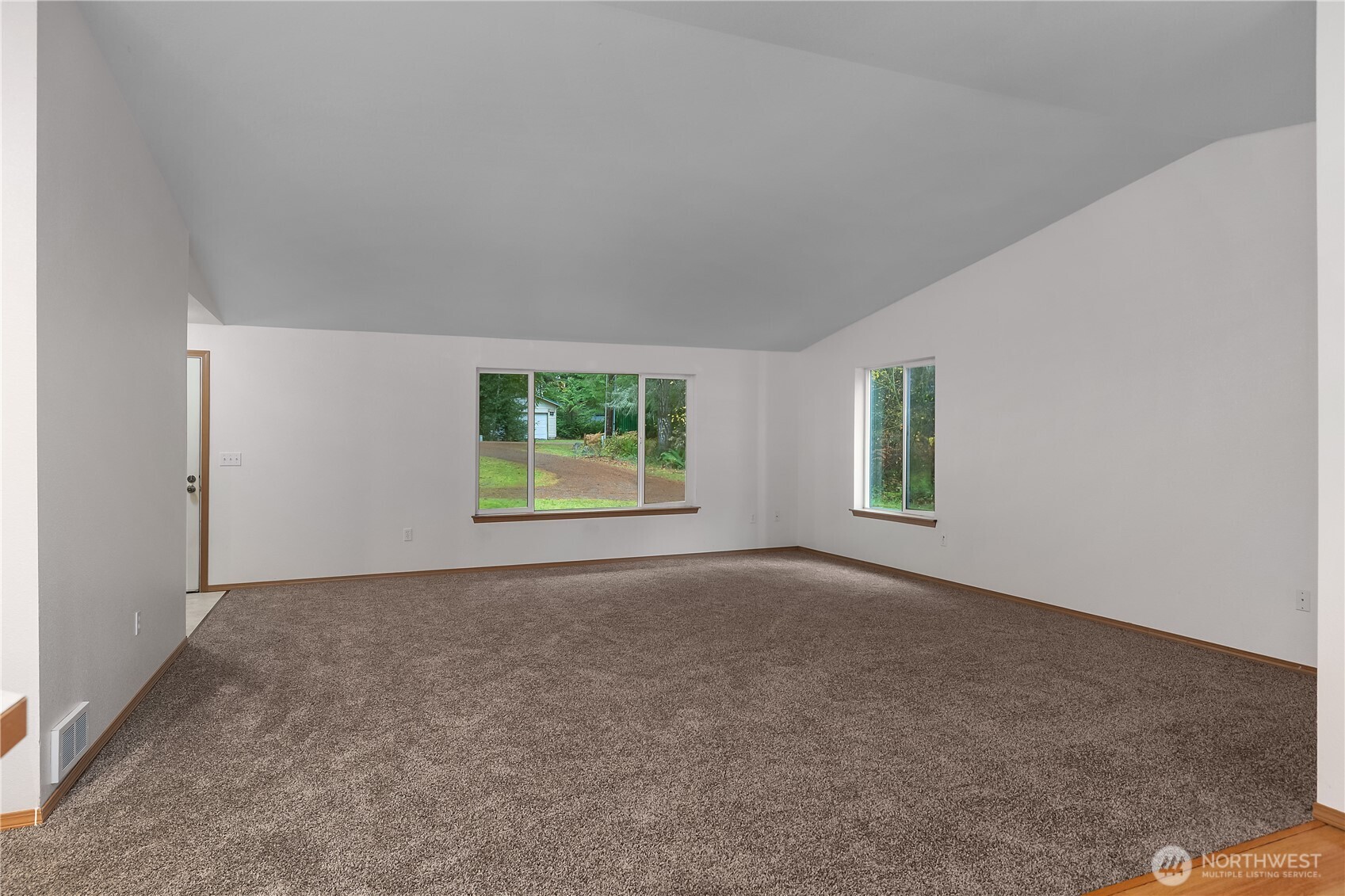 2261 East Phillips Lake Loop Road Shelton, WA 98584 - Photo 20 of 37 an empty room with windows and closet