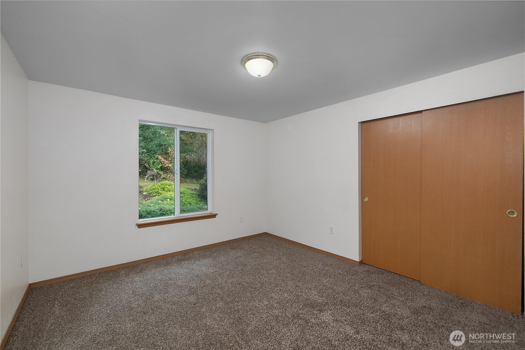 2261 East Phillips Lake Loop Road Shelton, WA 98584 - Photo 22 of 37 an empty room with a window