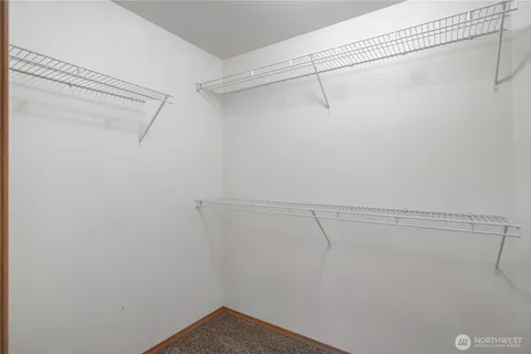 a view of a room with racks on the wall