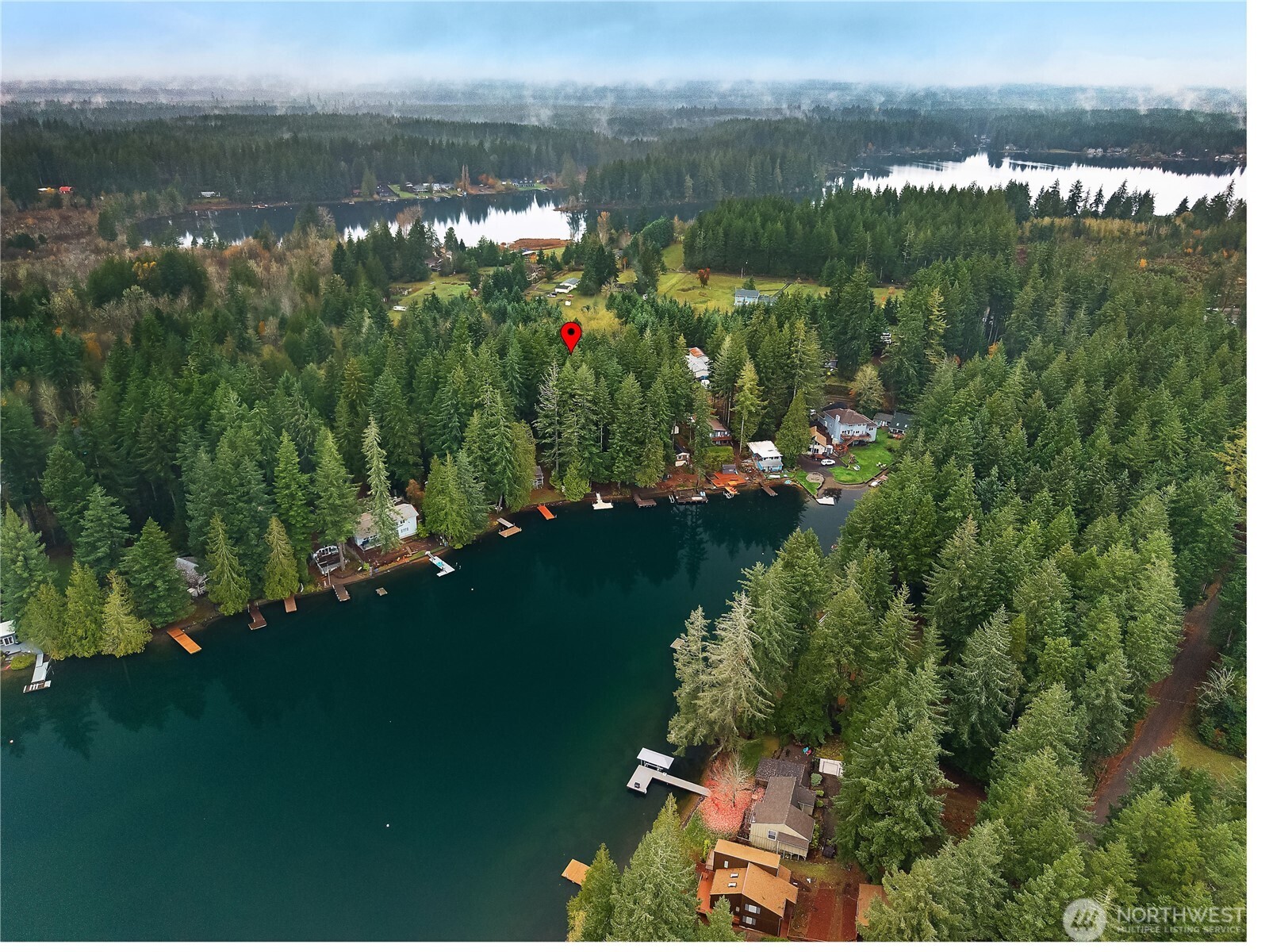 2261 East Phillips Lake Loop Road Shelton, WA 98584 - Photo 34 of 37 a view of a lake in middle of forest