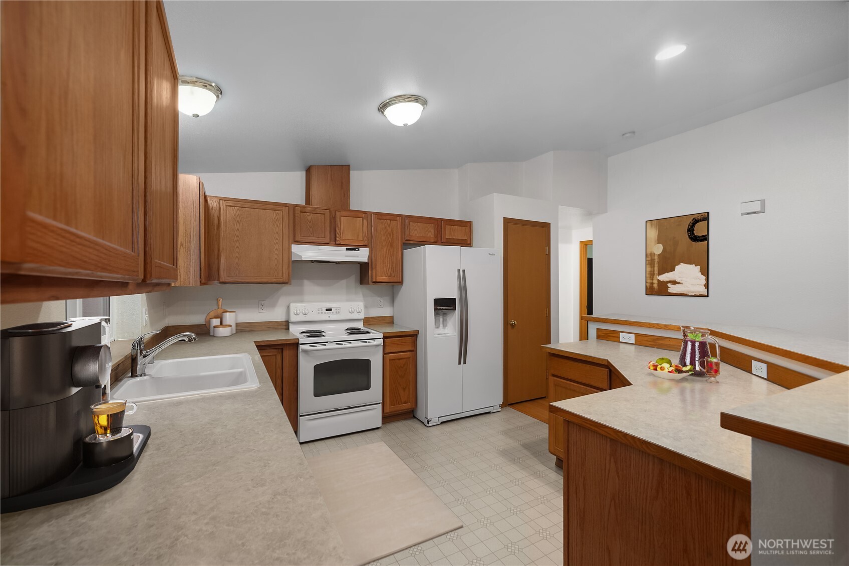2261 East Phillips Lake Loop Road Shelton, WA 98584 - Photo 5 of 37 a kitchen that has a sink and a stove in it