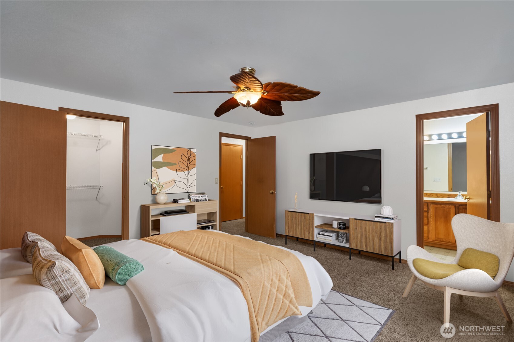 2261 East Phillips Lake Loop Road Shelton, WA 98584 - Photo 7 of 37 a bedroom with a bed and a flat screen tv