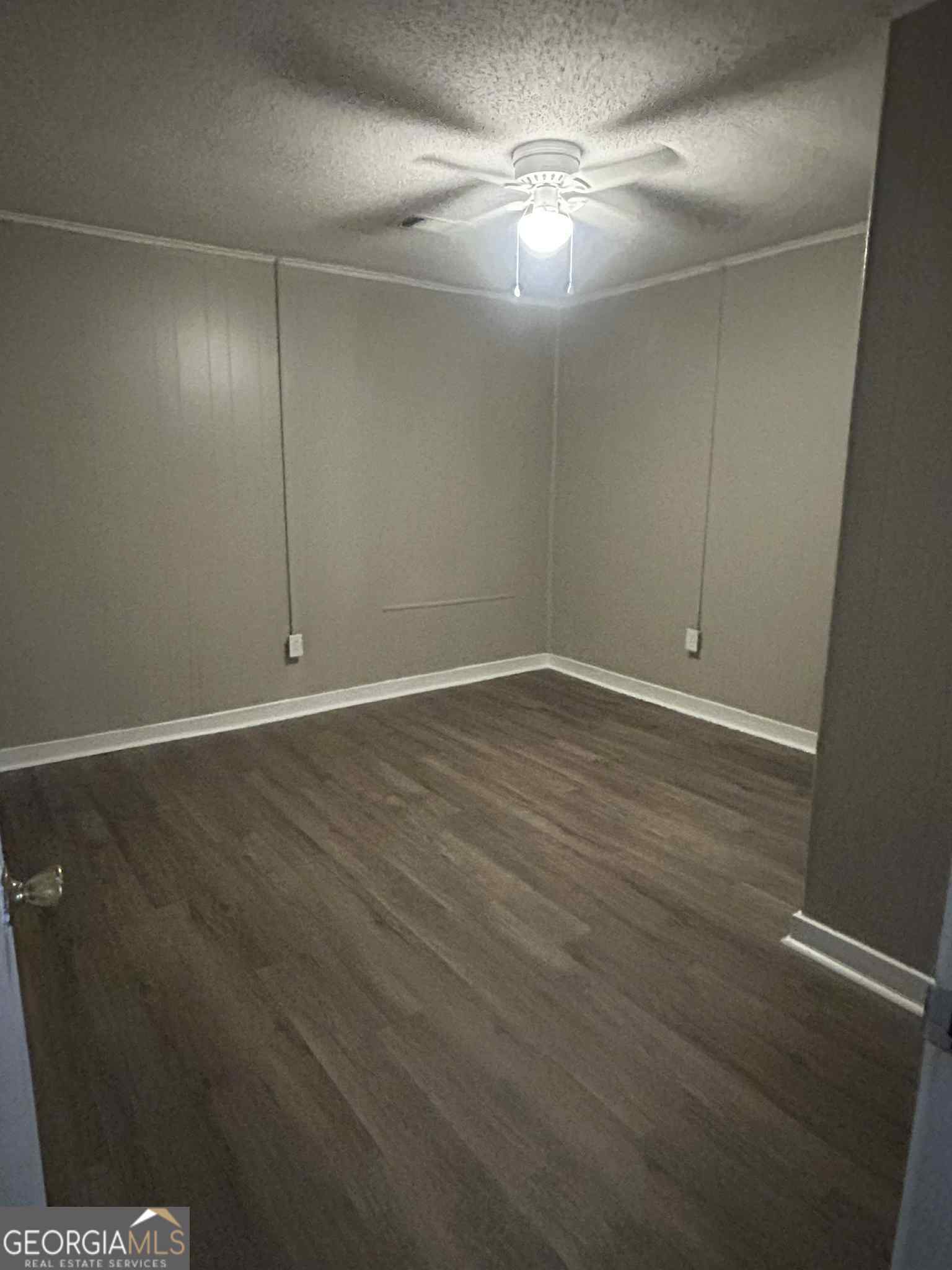 227 Straight Street, Unit B Macon, GA 31204 - Photo 5 of 5 en empty room with wooden floor