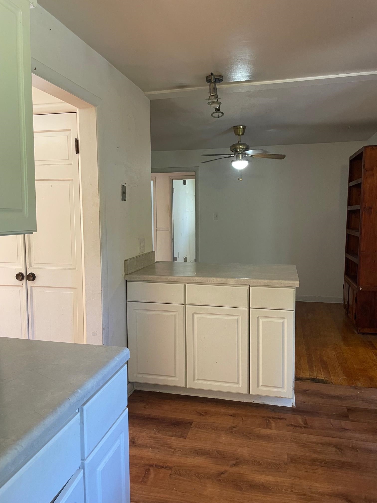253 Montelo Road Memphis, TN 38120 - Photo 6 of 13 a view of a kitchen with cabinets and wooden floor