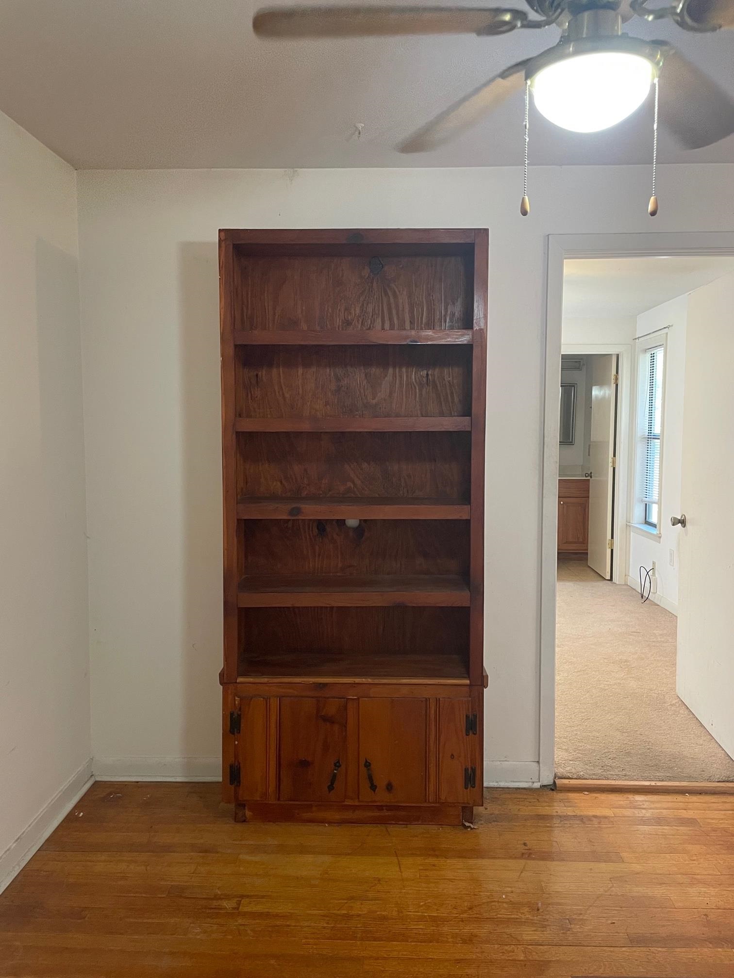 253 Montelo Road Memphis, TN 38120 - Photo 7 of 13 a view of an empty room with wooden floor and a window