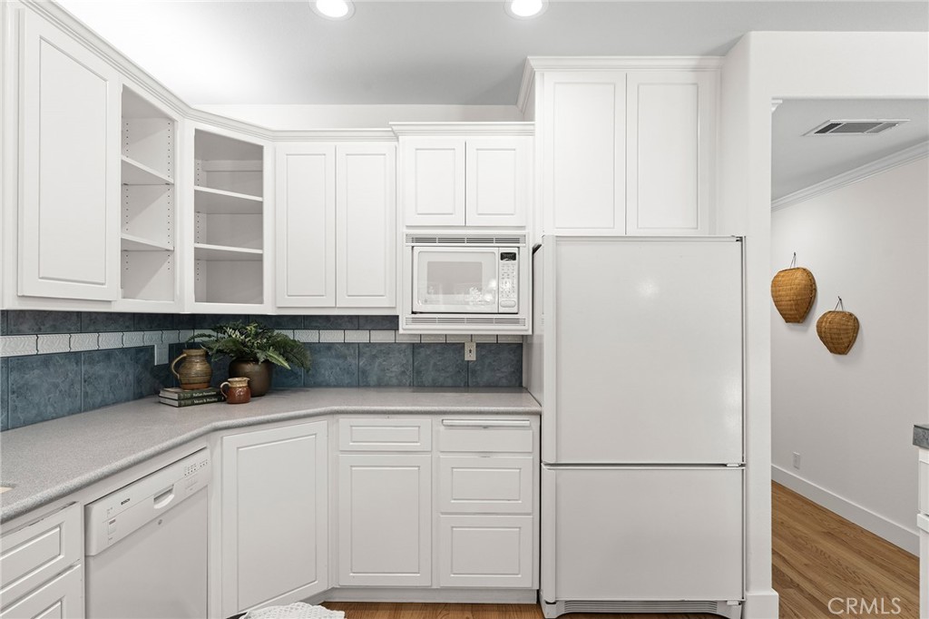 897 Filbert Avenue Chico, CA 95926 - Photo 17 of 66 a kitchen with a refrigerator and cabinets