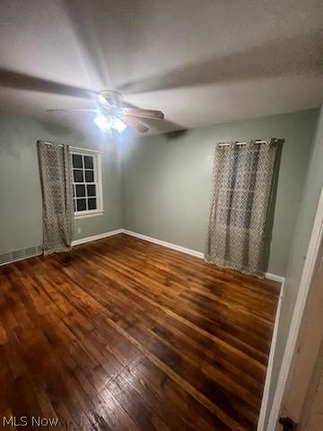 2444 Manchester Road Akron, OH 44314 - Photo 26 of 26 Empty room featuring ceiling fan and dark wood-type flooring