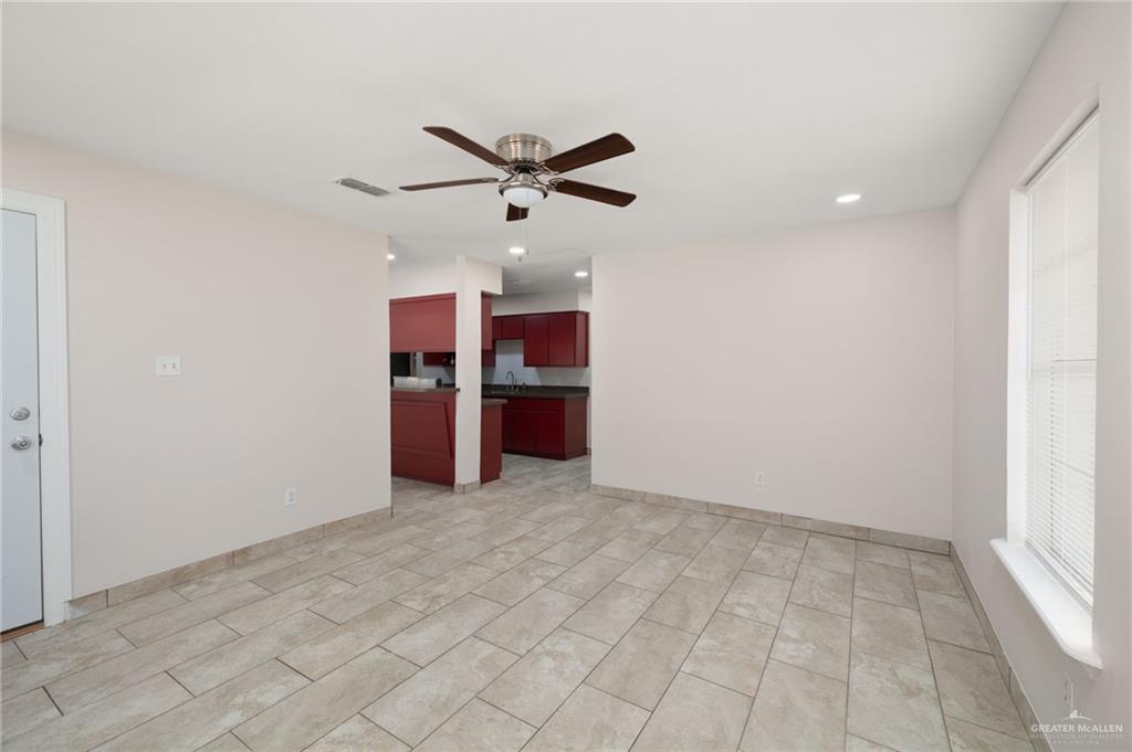 1913 South 35th Street McAllen, TX 78503 - Photo 4 of 12 an empty room with kitchen and stainless steel appliances