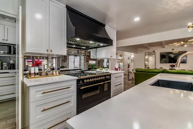 a cabinet with storage and utility room