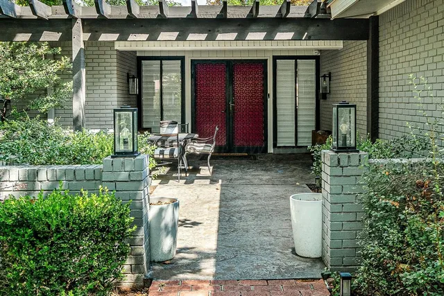 a view of a house with outdoor seating