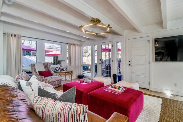 a bed room with two bed and a large window