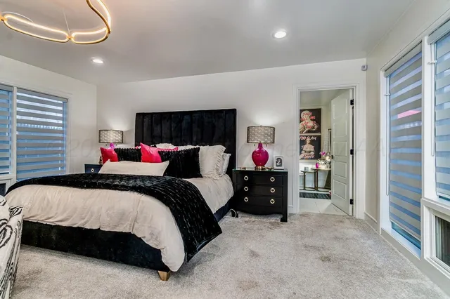 a bedroom with a bed and a couch