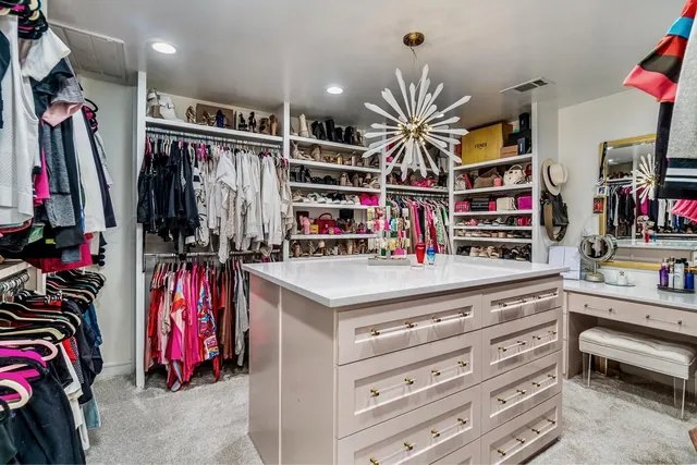 a bathroom with a painting on the wall and a shower