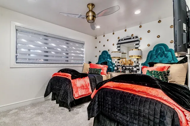 a living room with furniture and a mirror