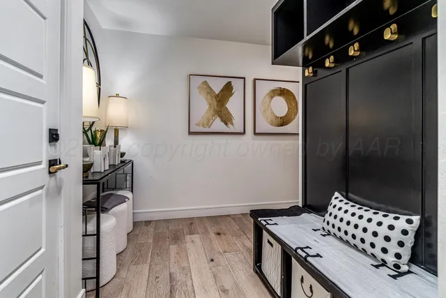 a view of a patio with table and chairs under an umbrella