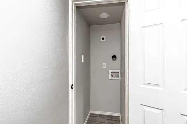a view of a bathroom from the hallway
