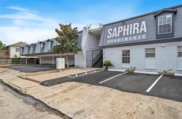 a view of a house with pool table and chairs