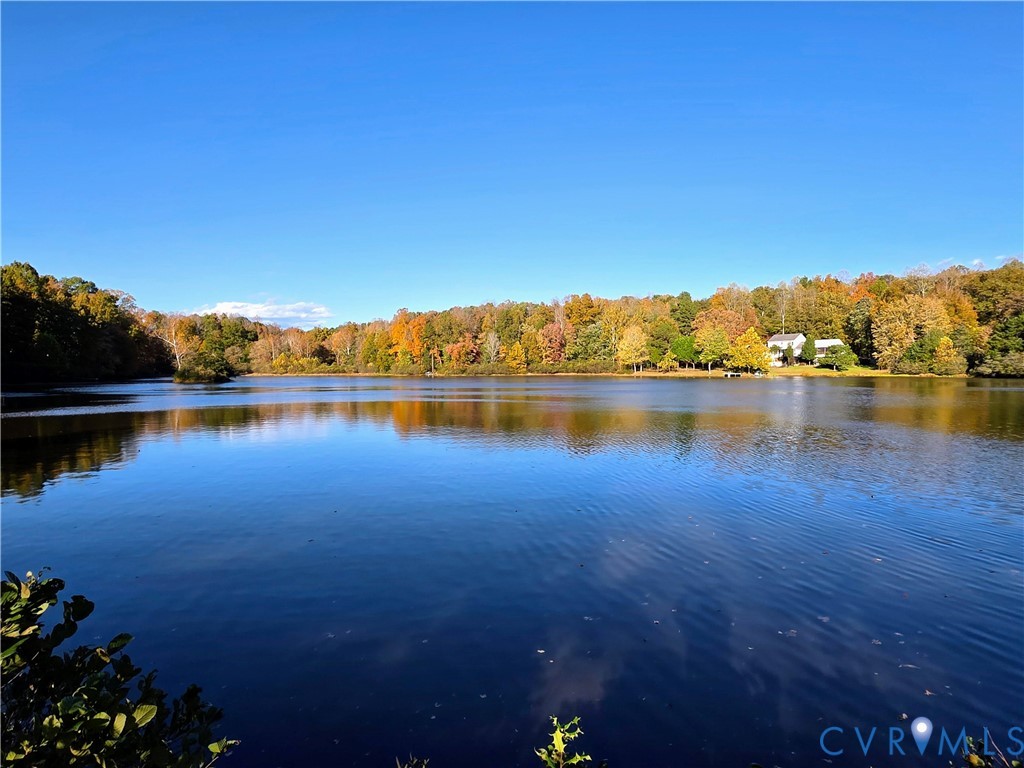 a view of a lake with houses in the back