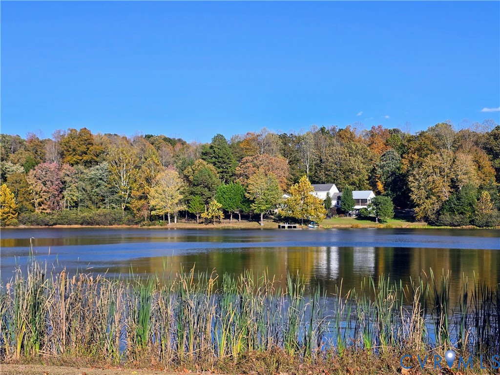 4063 Lively Lane Gum Spring, VA 23065 - Photo 3 of 4 a view of a lake with a mountain in the background