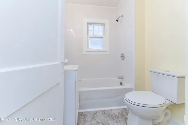 a bathroom with a sink toilet and tub