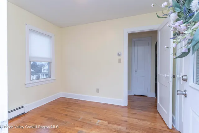 a view of a balcony with wooden floor