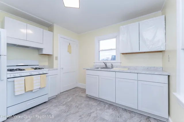 a view of kitchen and utility room